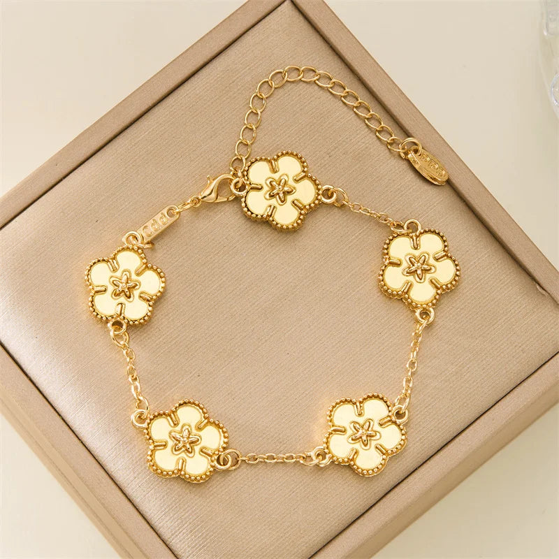 🌸 BloomCharm™ – Double-Sided Plum Blossom & Lucky Flower Bracelet